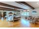 Inviting living room with hardwood floors, white sofa, and a brick fireplace at 2001 Lily Ct, Sanford, FL 32771