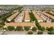 Community aerial view showcasing multiple buildings and residences, a pool, a lake, trees, and the overall neighborhood layout at 2030 Majorca Dr, Kissimmee, FL 34747
