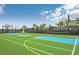 Multi-sport basketball court with professional-grade surface, hoops, and palm tree landscaping at 2030 Majorca Dr, Kissimmee, FL 34747