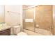 Tiled bathroom featuring a shower with a glass door and vanity with granite countertop at 2030 Majorca Dr, Kissimmee, FL 34747