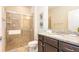 Modern bathroom features a glass shower, granite counters, and stylish vanity at 2030 Majorca Dr, Kissimmee, FL 34747