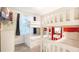 Fun bedroom with white bunk beds, a window, and a colorful accent wall at 2030 Majorca Dr, Kissimmee, FL 34747