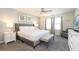 Comfortable bedroom with a plush bed, seating area, and soft, neutral color scheme at 2030 Majorca Dr, Kissimmee, FL 34747