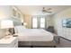 Stylish bedroom features a plush bed, a sitting area, and soft, natural light at 2030 Majorca Dr, Kissimmee, FL 34747