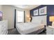 Charming bedroom with nautical decor, a comfortable bed, and soft, neutral lighting at 2030 Majorca Dr, Kissimmee, FL 34747