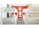 Fun bedroom with white bunk beds, a window, and a colorful accent wall at 2030 Majorca Dr, Kissimmee, FL 34747