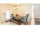 Dining room featuring an ornate mirror, wood dining table, and seating for six at 2030 Majorca Dr, Kissimmee, FL 34747