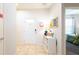 Inviting entryway with tiled floors, a white door and decorative elements for a welcoming ambiance at 2030 Majorca Dr, Kissimmee, FL 34747