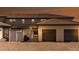 Beautiful home exterior with a two-car garage, brick pavers, and a walkway leading to a screened-in lanai at 2030 Majorca Dr, Kissimmee, FL 34747
