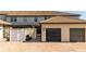 Home exterior with a garage, brick-paved patio, and view of enclosed porch area with fence and a bench near the entryway at 2030 Majorca Dr, Kissimmee, FL 34747