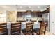 Well-equipped kitchen with granite countertops, dark wood cabinetry, and stainless steel appliances at 2030 Majorca Dr, Kissimmee, FL 34747