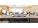 Open concept kitchen island with granite countertops and stainless steel sink at 2030 Majorca Dr, Kissimmee, FL 34747