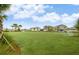 Expansive green lawn, perfect for recreational activities, with soccer goals and beautiful homes in the background at 2030 Majorca Dr, Kissimmee, FL 34747