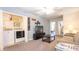 Bright and cozy living room with a modern TV, comfortable seating, and convenient laundry area at 2030 Majorca Dr, Kissimmee, FL 34747