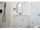 Bright bathroom featuring a white vanity, black hardware, and sleek black framed mirror at 240 W Palmetto Ave, Deland, FL 32720