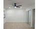 Bright bedroom with a ceiling fan, mirrored closet doors, and natural light at 240 W Palmetto Ave, Deland, FL 32720