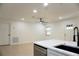 Bright kitchen features a breakfast bar and an adjacent dining room with updated flooring at 240 W Palmetto Ave, Deland, FL 32720