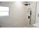 Shower area with white marbled tile, black fixtures, and a window for natural light at 240 W Palmetto Ave, Deland, FL 32720