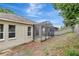 Backyard with a screened-in patio featuring tile flooring and a fenced yard at 2468 Cimmaron Ash Way, Apopka, FL 32703