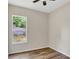 Bedroom featuring hardwood floors and a window view at 2468 Cimmaron Ash Way, Apopka, FL 32703