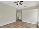 A cozy bedroom featuring a ceiling fan and hardwood floors at 2468 Cimmaron Ash Way, Apopka, FL 32703