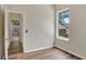 Bedroom with hardwood floors and a view at 2468 Cimmaron Ash Way, Apopka, FL 32703