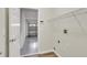 Laundry area with utility connections and wire shelving in an alcove near the garage at 2468 Cimmaron Ash Way, Apopka, FL 32703