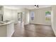 Bright dining and living area with hardwood floors and sliding glass doors to the outdoor space at 2468 Cimmaron Ash Way, Apopka, FL 32703