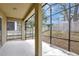 A view of the screened patio showing its tile floor and view of the fenced yard at 2468 Cimmaron Ash Way, Apopka, FL 32703