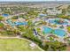 Community waterpark view showcasing pools, slides, clubhouse, and surrounding residential area at 257 Auburn Ave, Kissimmee, FL 34747