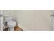 Bathroom with a toilet, tiled floor, and white walls at 257 Auburn Ave, Kissimmee, FL 34747