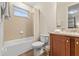 Bathroom with a shower-tub combo, single vanity, and tile flooring at 257 Auburn Ave, Kissimmee, FL 34747