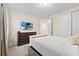 Secondary bedroom with walk-in closet, TV, and lots of light at 257 Auburn Ave, Kissimmee, FL 34747