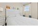 Bright bedroom featuring a white bed frame with sports decor above the headboard at 257 Auburn Ave, Kissimmee, FL 34747