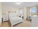 Bedroom features lots of natural light with neutral color walls and carpet, plus minimalist decor at 257 Auburn Ave, Kissimmee, FL 34747