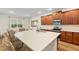 Spacious kitchen island with seating, quartz countertops, stainless steel appliances, and ample cabinet space at 257 Auburn Ave, Kissimmee, FL 34747