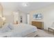 The main bedroom has an attached bathroom, tv, walk-in closet, and comfortable king size bed at 257 Auburn Ave, Kissimmee, FL 34747