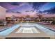 Stunning twilight view of the pool and spa, set against a beautiful evening sky at 257 Auburn Ave, Kissimmee, FL 34747
