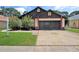 Charming single-Gathering home with well-maintained lawn and two car garage at 2656 Whisper Lakes Club Cir, Orlando, FL 32837