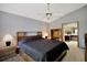 Spacious main bedroom features a vaulted ceiling and is connected to the en suite bathroom at 2656 Whisper Lakes Club Cir, Orlando, FL 32837