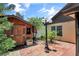 Backyard shed featuring fresh paint and brick pavers at 2656 Whisper Lakes Club Cir, Orlando, FL 32837