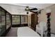 Bright sunroom with ample natural light, featuring a ceiling fan and outdoor views at 2656 Whisper Lakes Club Cir, Orlando, FL 32837