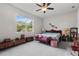 Serene bedroom with a large window, carpeted floors, and elegant decor at 2723 Forestdale St, St Cloud, FL 34771