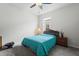 Cozy bedroom with comfortable bed, ceiling fan, and natural light from the window at 2723 Forestdale St, St Cloud, FL 34771