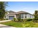 Charming single-Gathering home with a well-manicured lawn and a two-car garage, showcasing curb appeal at 2723 Forestdale St, St Cloud, FL 34771