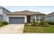 Charming single-story home with a well-maintained lawn, a two-car garage, and lovely curb appeal at 2723 Forestdale St, St Cloud, FL 34771