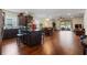 Bright open concept kitchen/dining area with hardwood floors and sliding glass doors to the outdoor patio at 2723 Forestdale St, St Cloud, FL 34771