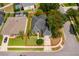 Aerial view of the property showing home, lush trees, and surrounding neighborhood at 2745 University Acres Dr, Orlando, FL 32817
