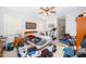 Bedroom with ceiling fan, carpet flooring, and plenty of natural light at 2745 University Acres Dr, Orlando, FL 32817