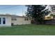 The backyard has a well-maintained lawn, and mature trees, perfect for outdoor entertaining and relaxation at 2808 Drake Dr, Orlando, FL 32810